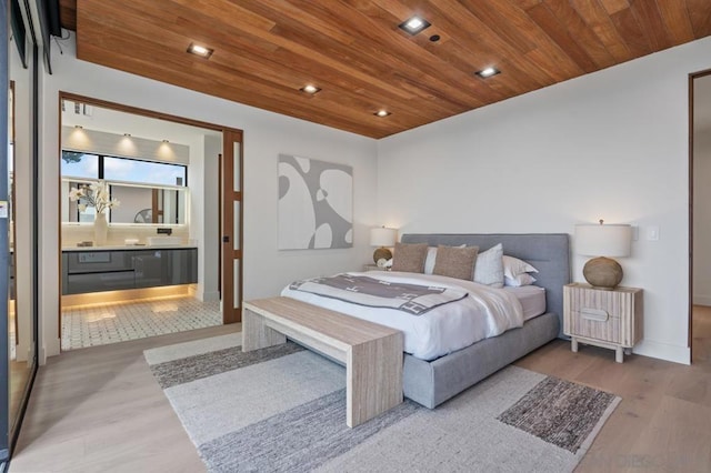 bedroom with light hardwood / wood-style floors and wood ceiling