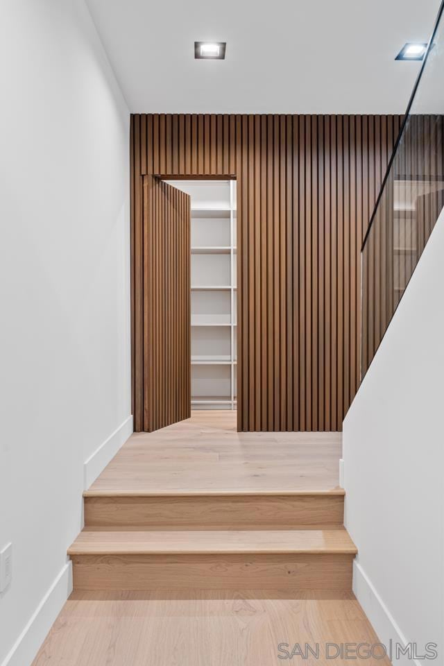 stairway featuring hardwood / wood-style floors