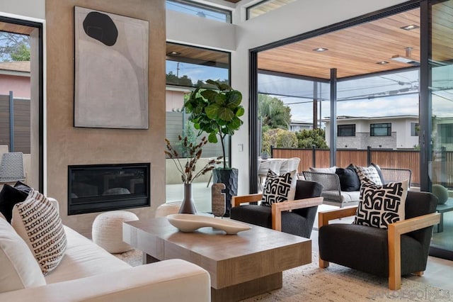 interior space with a large fireplace and wooden ceiling