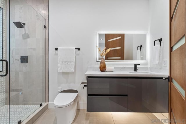 bathroom featuring vanity, toilet, and walk in shower