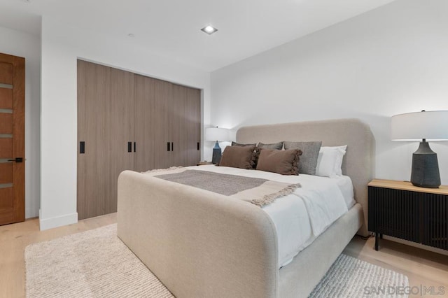 bedroom with light hardwood / wood-style floors