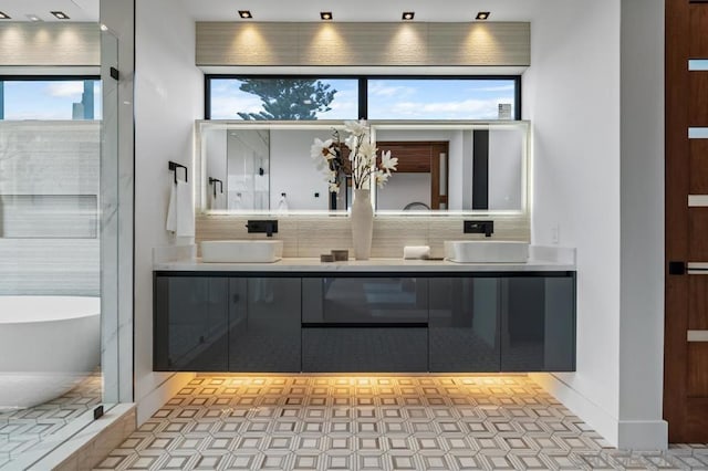 bathroom with vanity and a bath