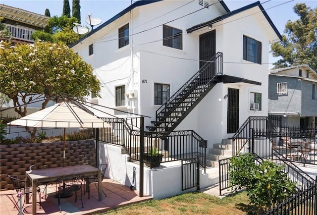 rear view of house with a patio area