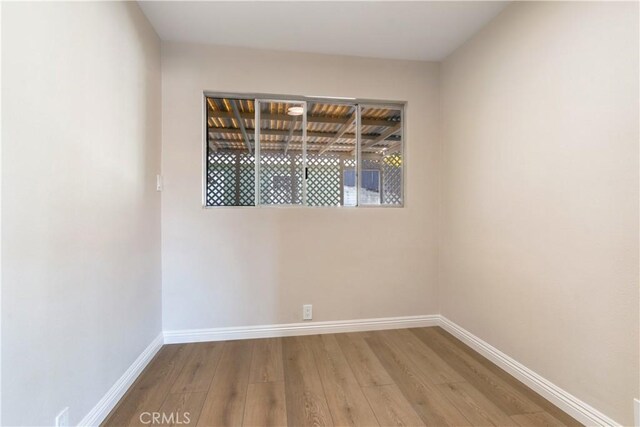 unfurnished room featuring light hardwood / wood-style flooring