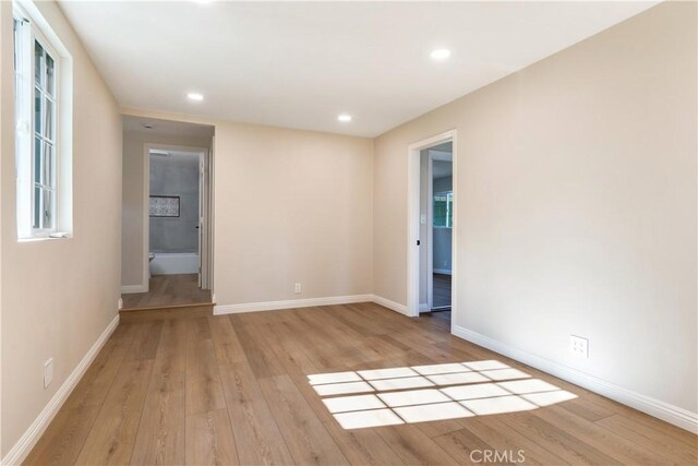 unfurnished room featuring light wood-type flooring