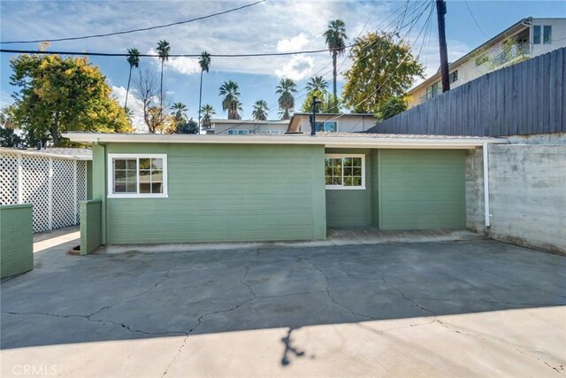 view of side of property with a patio area