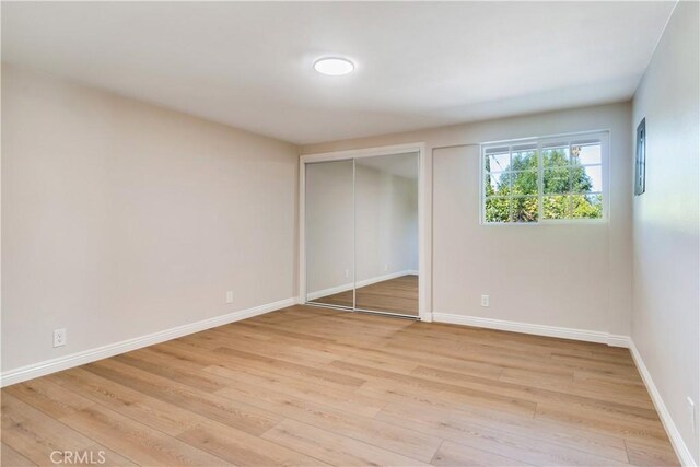 unfurnished bedroom with light hardwood / wood-style floors