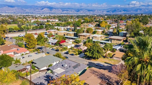 birds eye view of property with a mountain view