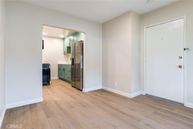 foyer with light wood-type flooring