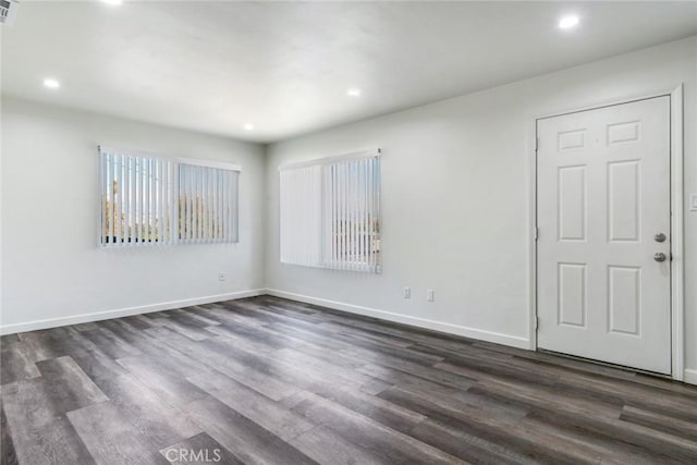 spare room featuring dark hardwood / wood-style floors