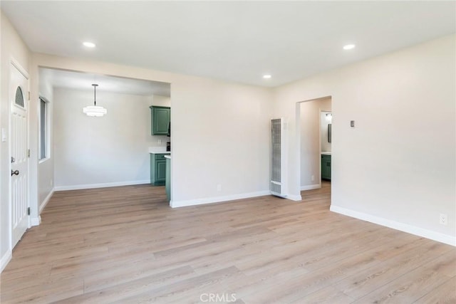 spare room with light hardwood / wood-style flooring