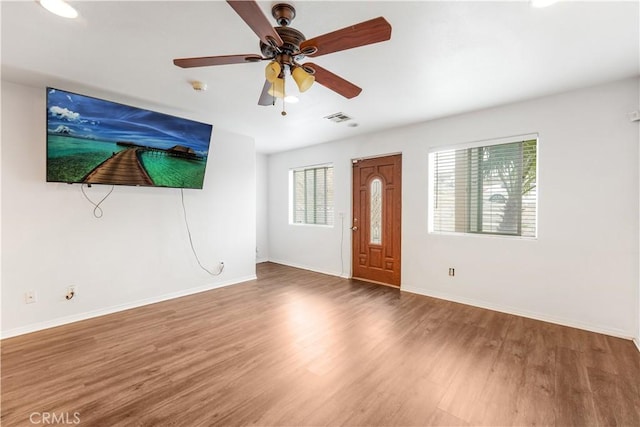 interior space featuring hardwood / wood-style floors and ceiling fan