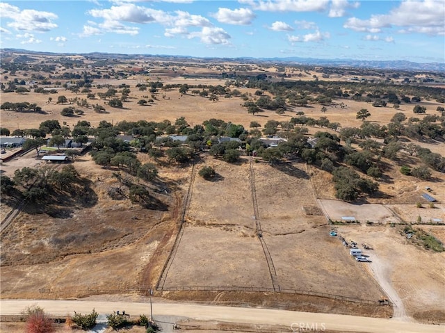 birds eye view of property with a rural view