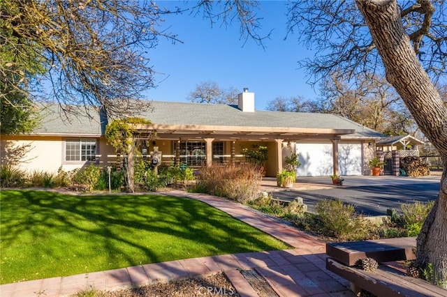 ranch-style house with a front yard and a garage