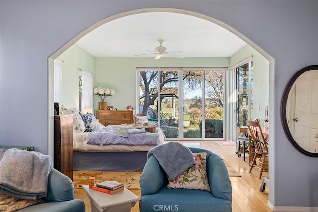 bedroom with ceiling fan and light hardwood / wood-style flooring