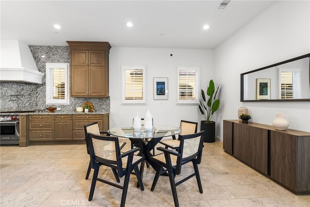 dining area with plenty of natural light, visible vents, and recessed lighting