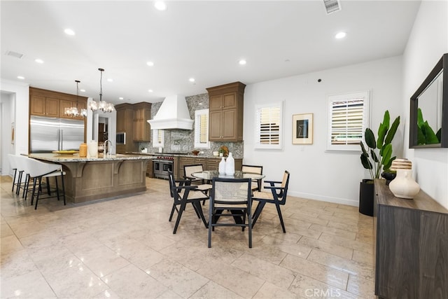 dining room featuring an inviting chandelier, visible vents, baseboards, and recessed lighting