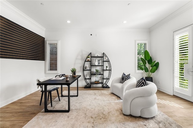 office with light wood-style floors, ornamental molding, and recessed lighting