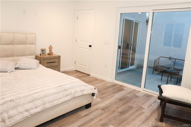 bedroom with wood-type flooring and a closet