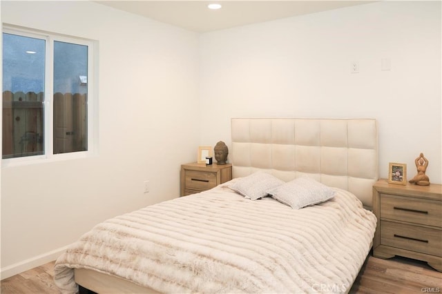 bedroom with dark wood-type flooring