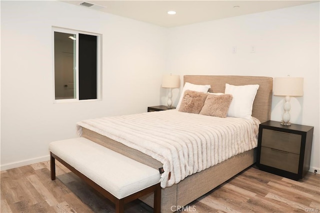 bedroom featuring hardwood / wood-style flooring