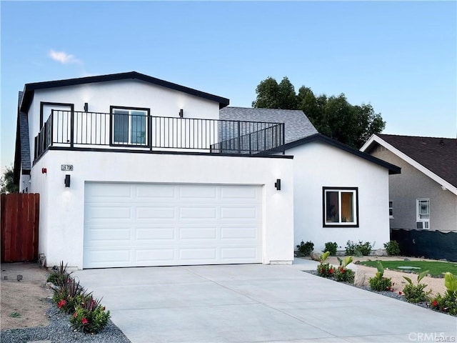 view of front of house with a balcony and a garage