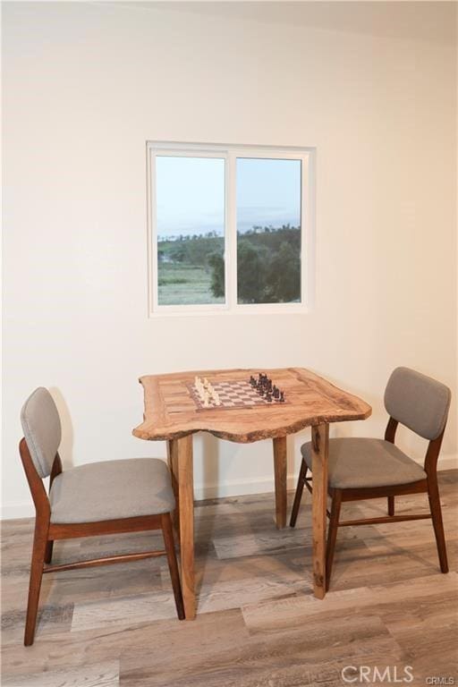 dining space featuring hardwood / wood-style floors