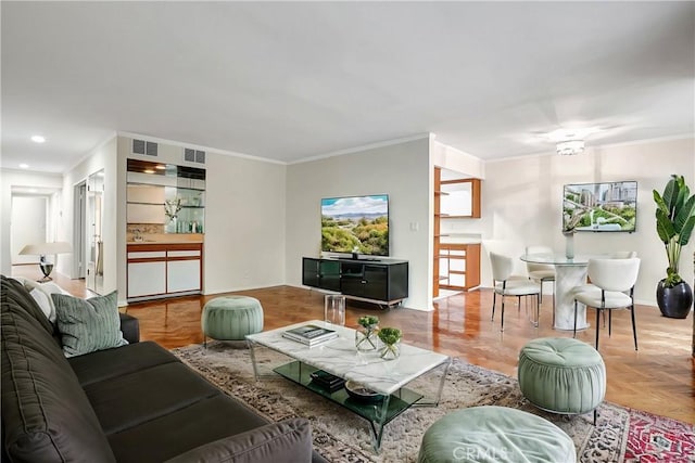 living room with crown molding and light parquet floors