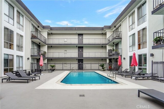 view of swimming pool featuring a patio