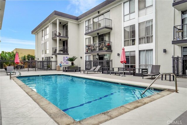 view of pool featuring a patio