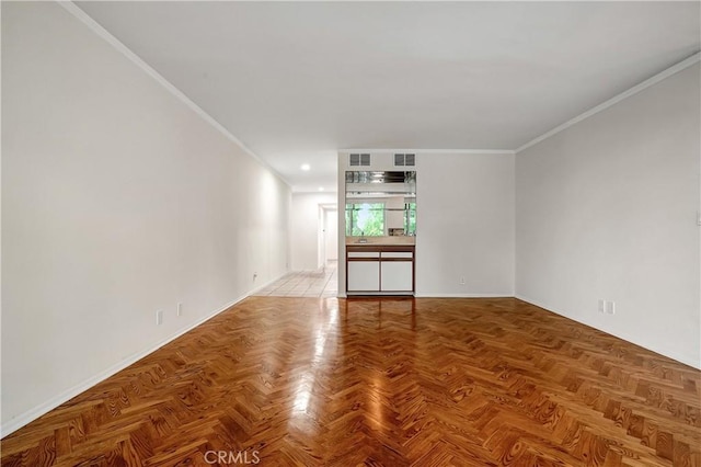 unfurnished living room with crown molding and parquet flooring