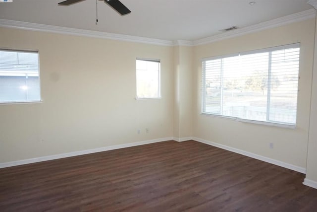 spare room with dark hardwood / wood-style flooring, ceiling fan, and ornamental molding