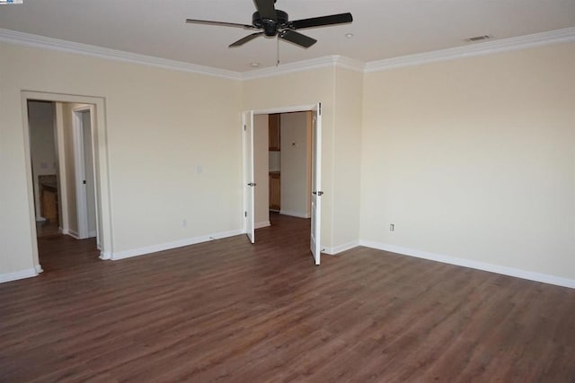 spare room with dark hardwood / wood-style floors, ceiling fan, and ornamental molding