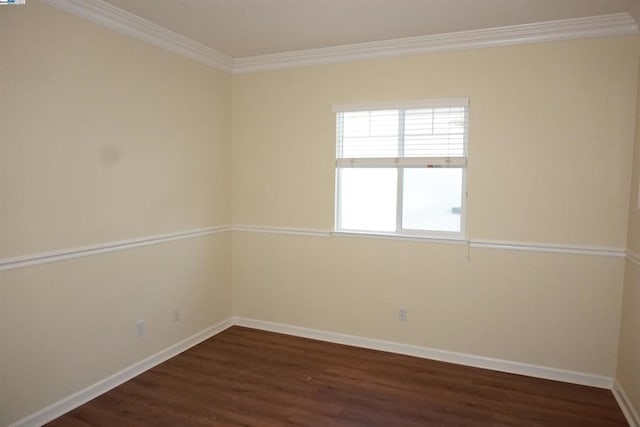 unfurnished room with dark hardwood / wood-style floors and crown molding