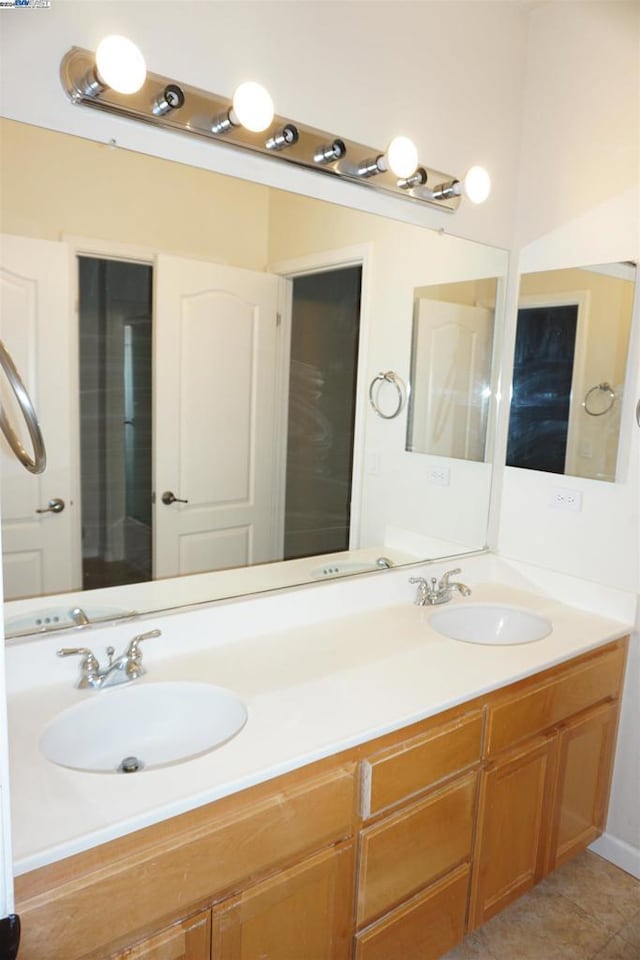 bathroom with tile patterned floors and vanity