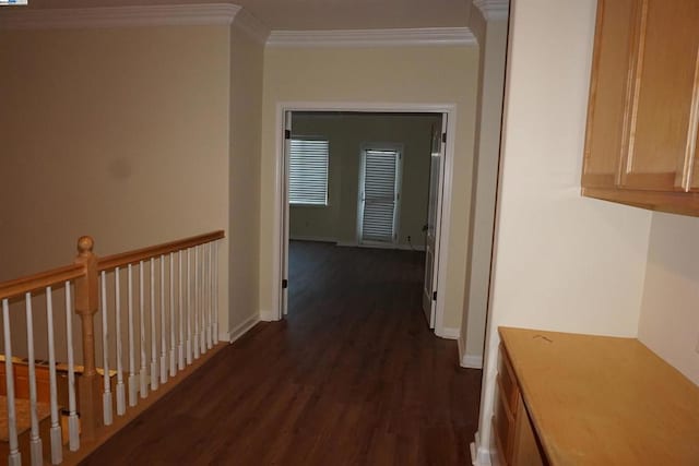 hall with dark hardwood / wood-style flooring and ornamental molding