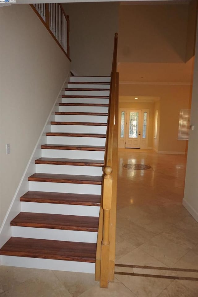 staircase featuring tile patterned floors