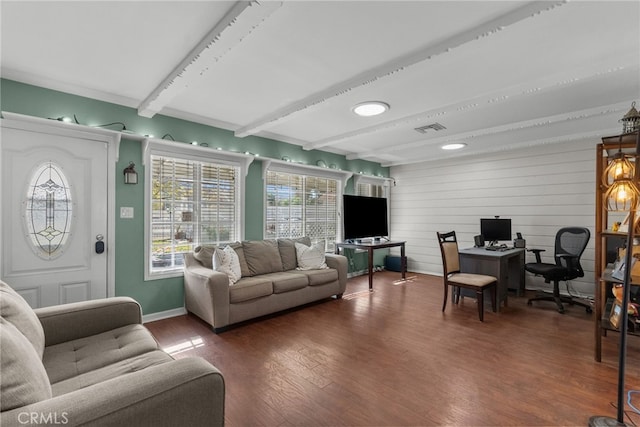 living room featuring beam ceiling and dark wood-type flooring