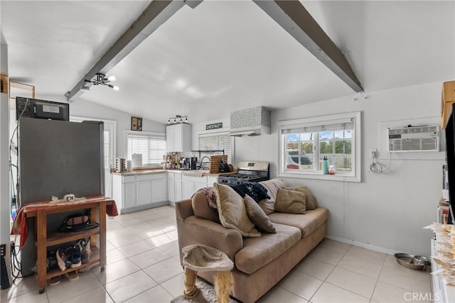 living room with a wall unit AC, vaulted ceiling with beams, sink, and light tile patterned floors