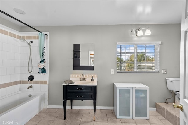 bathroom with vanity, tiled shower / bath combo, and tile patterned floors