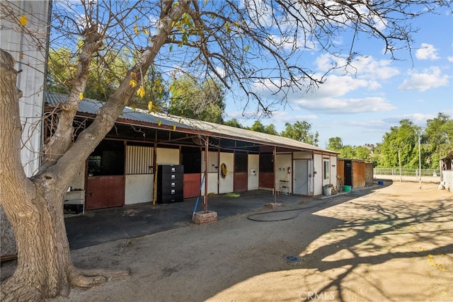 view of front of house featuring an outbuilding