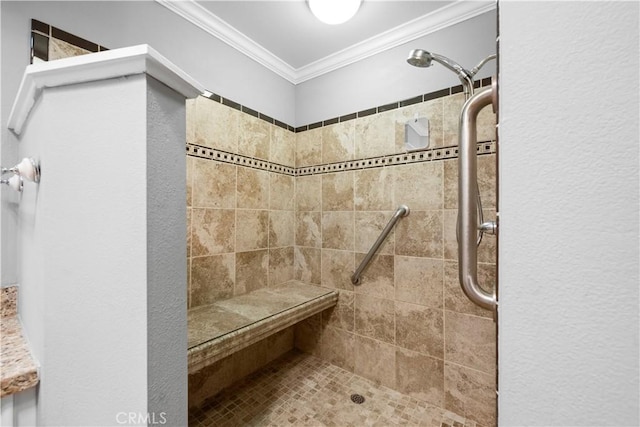 bathroom featuring ornamental molding and a tile shower