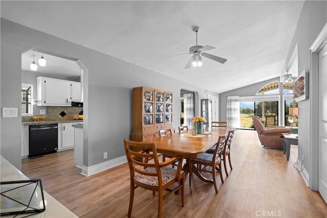 dining room with ceiling fan, light hardwood / wood-style floors, and lofted ceiling