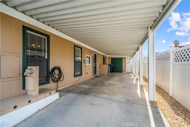 view of patio / terrace with a carport