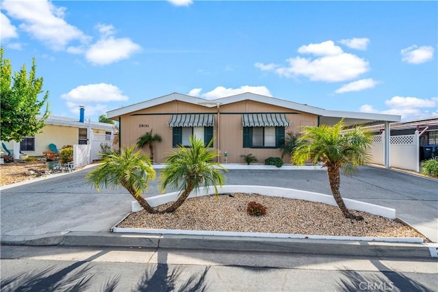 view of front of property with a carport