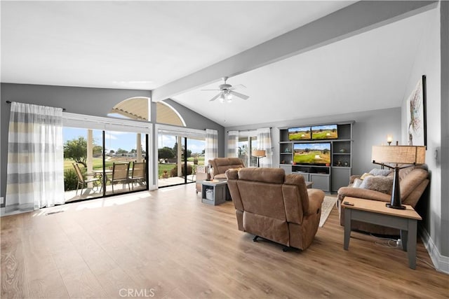 living room featuring ceiling fan, vaulted ceiling with beams, and light wood-type flooring