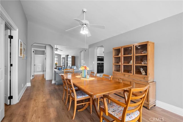 dining area featuring hardwood / wood-style flooring and ceiling fan