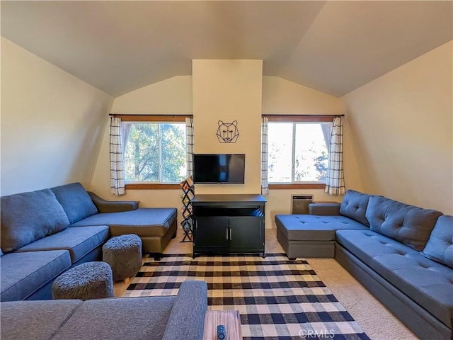 living room featuring carpet flooring and lofted ceiling