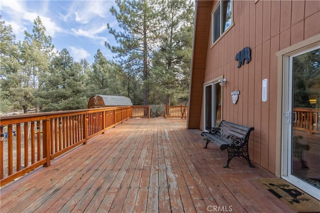 deck featuring a shed