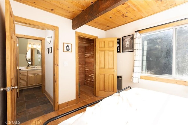 bedroom with beam ceiling, dark hardwood / wood-style floors, multiple windows, and wood ceiling